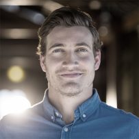 Portrait of smiling man standing in restaurant